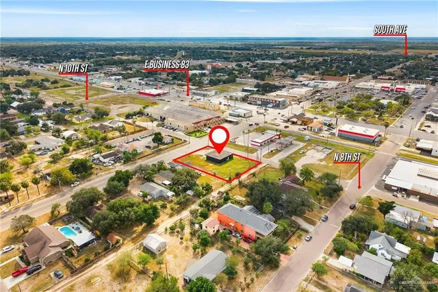 an aerial view of residential houses with outdoor space