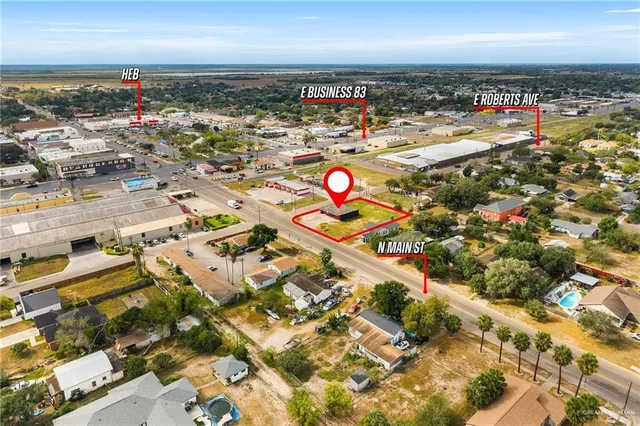 an aerial view of residential building and ocean