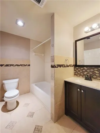 a bathroom with a sink and a toilet