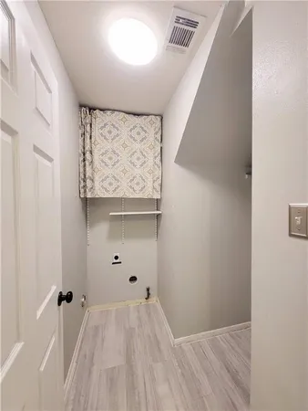 a view of a closet with cabinet