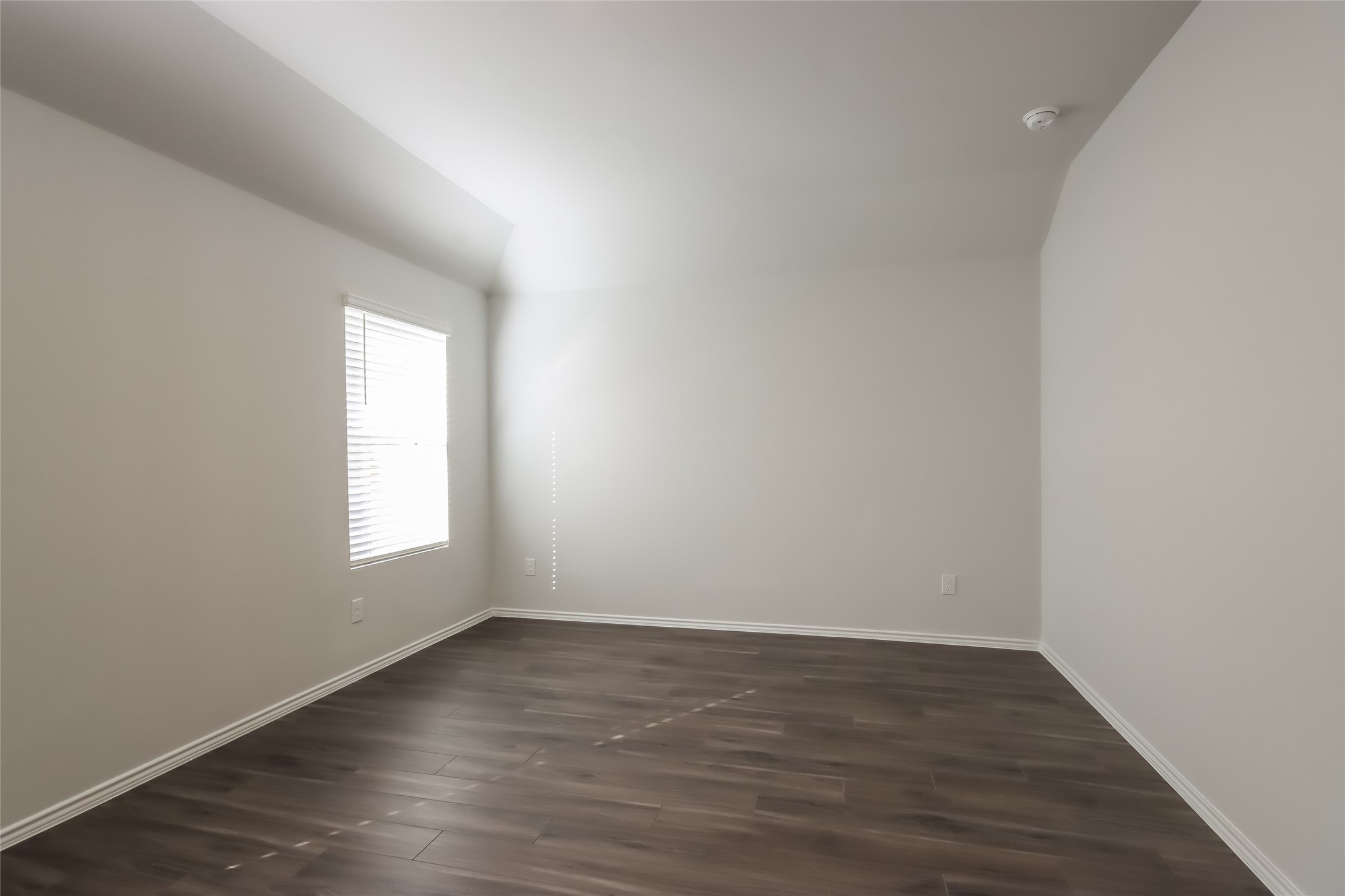 22419 Verdin Road Splendora, TX 77372 - Photo 7 of 17 an empty room with wooden floor and window