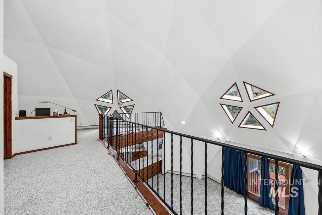 360 Lake Creek Riggins, ID 83549 - Photo 14 of 50 Staircase featuring carpet floors and a baseboard heating unit