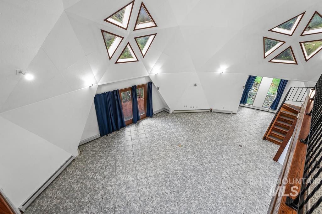 360 Lake Creek Riggins, ID 83549 - Photo 16 of 50 Additional living space featuring a baseboard heating unit and lofted ceiling