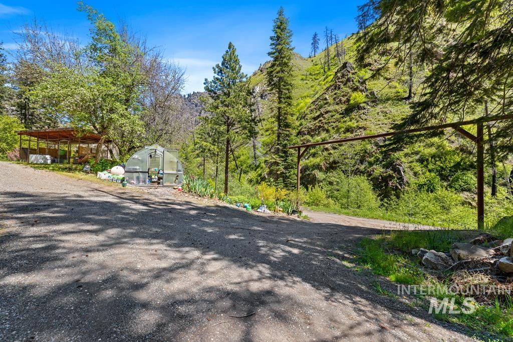 360 Lake Creek Riggins, ID 83549 - Photo 33 of 50 View of dirt / gravel road with an exterior structure