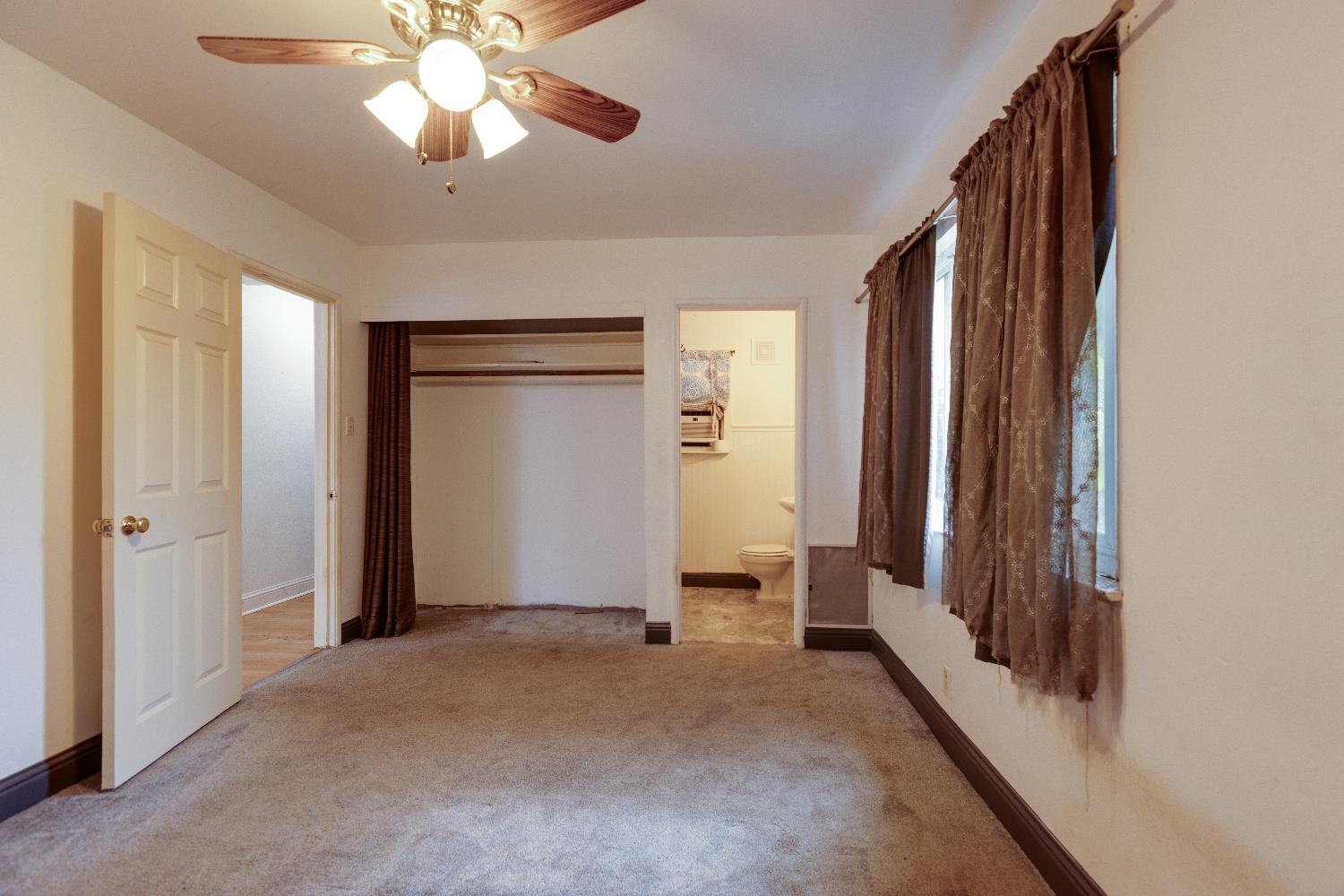 1570 East 26th Street Merced, CA 95340 - Photo 15 of 20 wooden floor in an empty room with a window