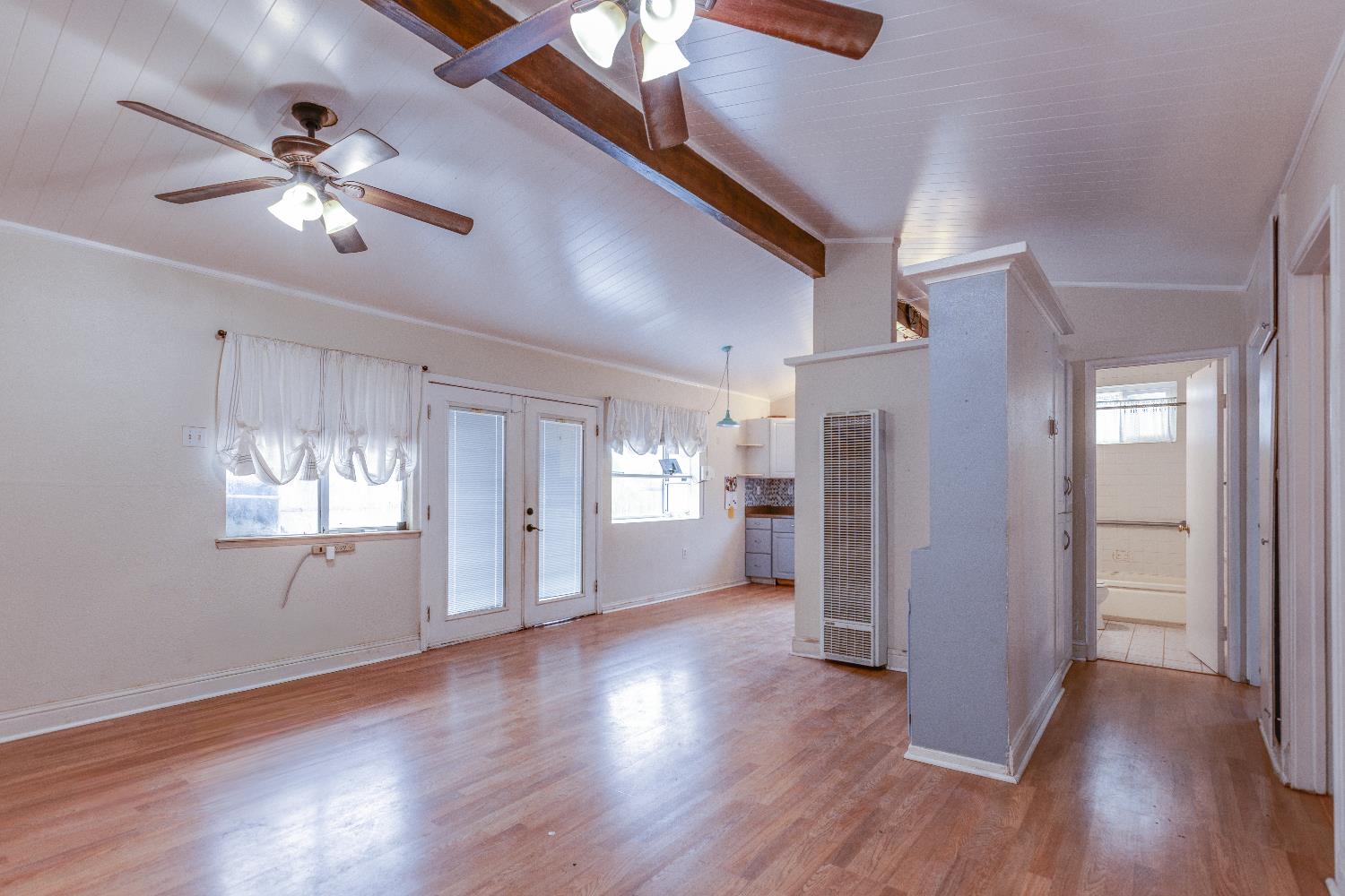 1570 East 26th Street Merced, CA 95340 - Photo 7 of 20 a view of a livingroom with a ceiling fan and window