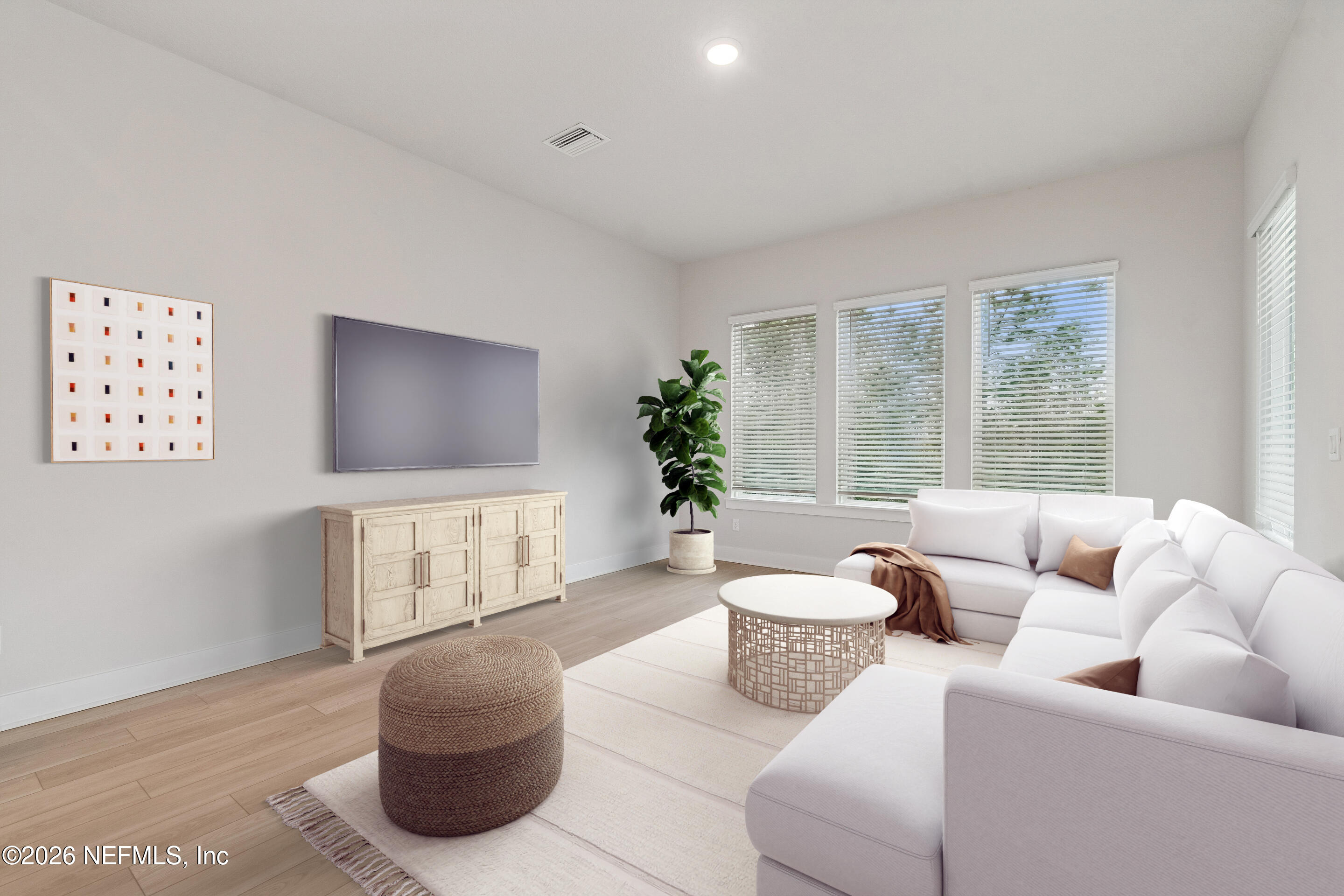 10165 Element Road Jacksonville, FL 32256 - Photo 12 of 25 a living room with furniture and a potted plant