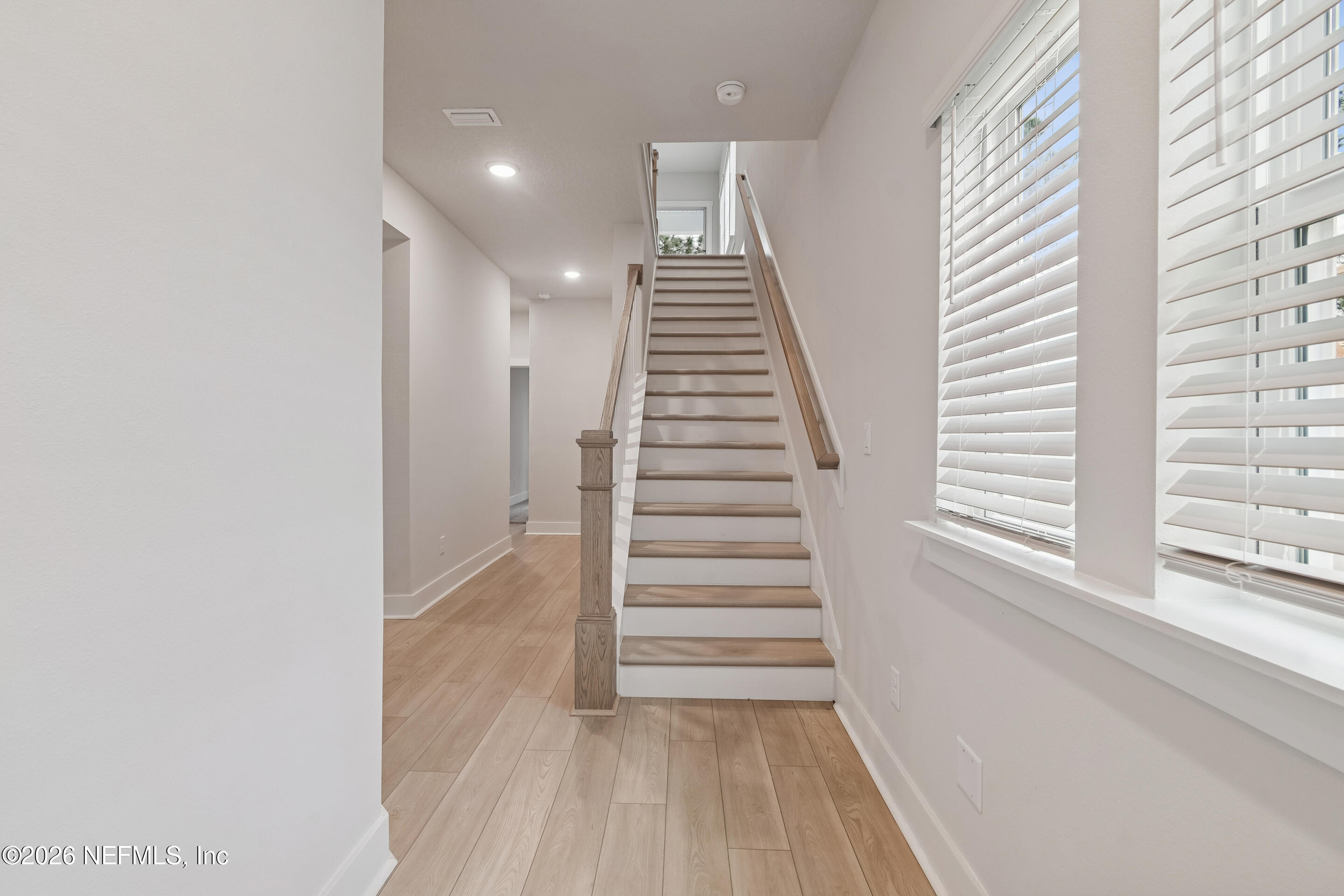 10165 Element Road Jacksonville, FL 32256 - Photo 13 of 25 a view of a hallway with wooden floor and entryway