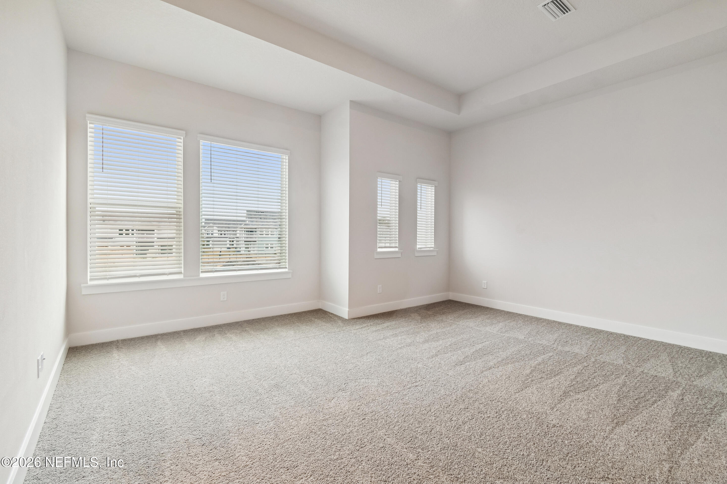 10165 Element Road Jacksonville, FL 32256 - Photo 17 of 25 an empty room with windows