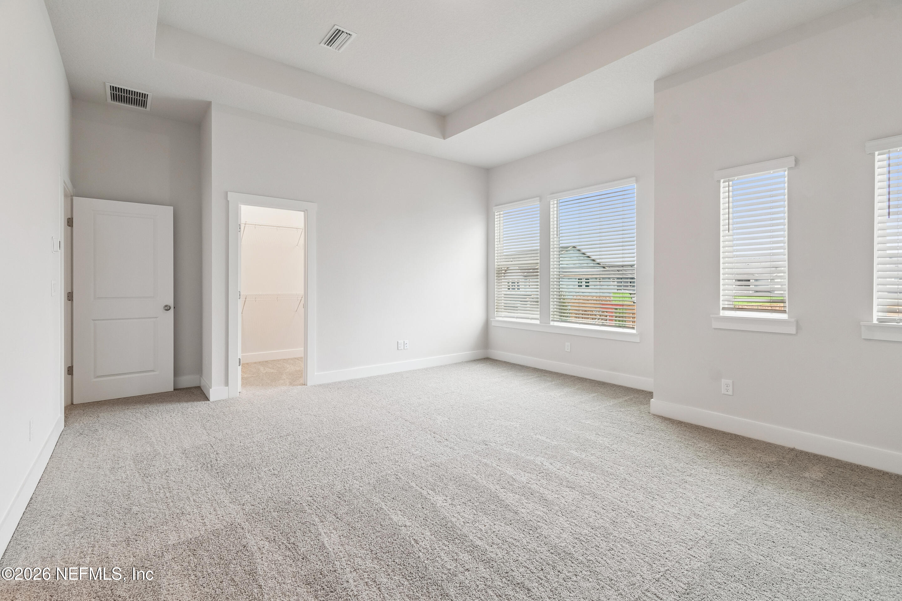10165 Element Road Jacksonville, FL 32256 - Photo 19 of 25 a view of an empty room with windows