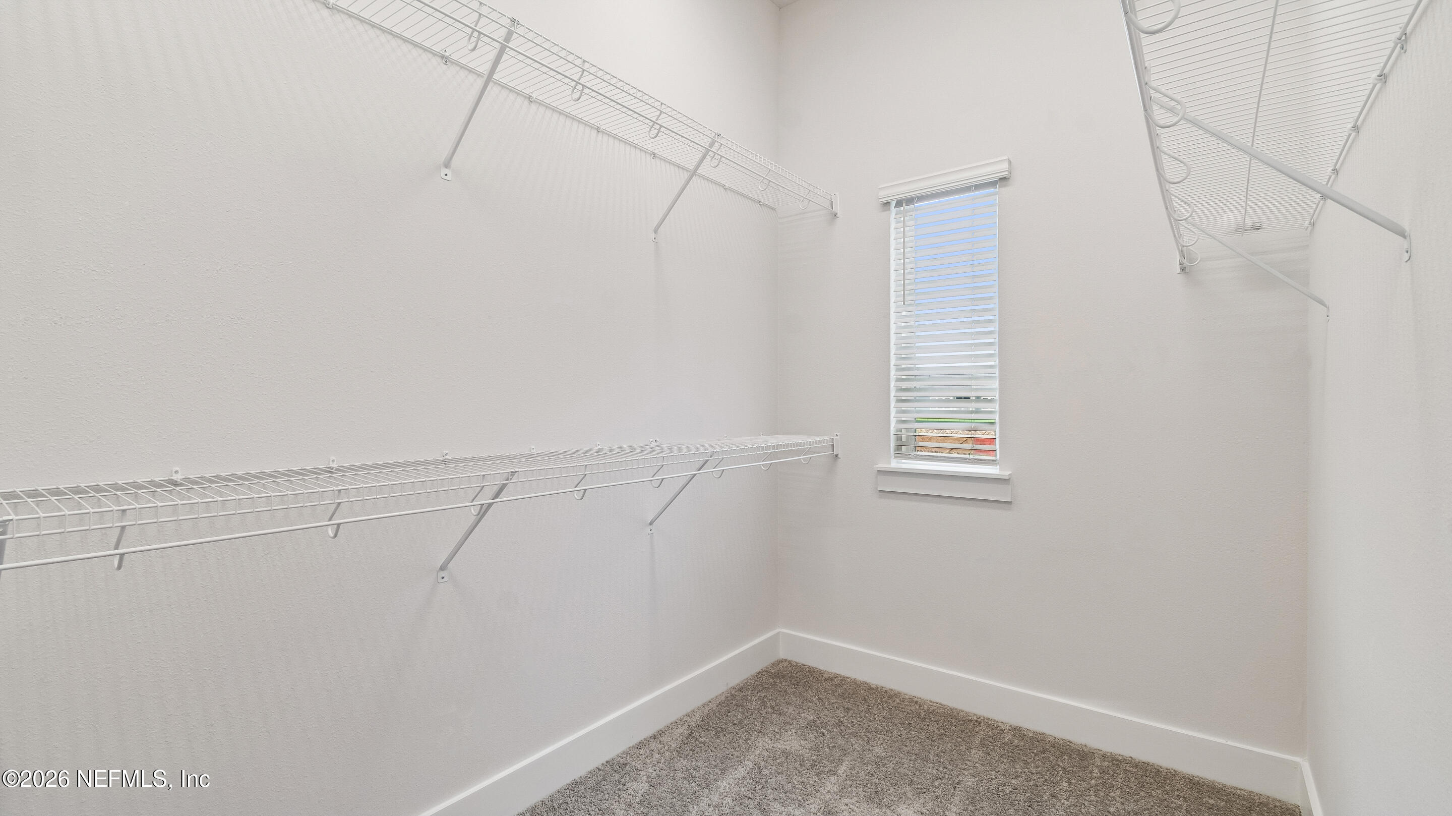 10165 Element Road Jacksonville, FL 32256 - Photo 22 of 25 a view of a room with racks on the wall
