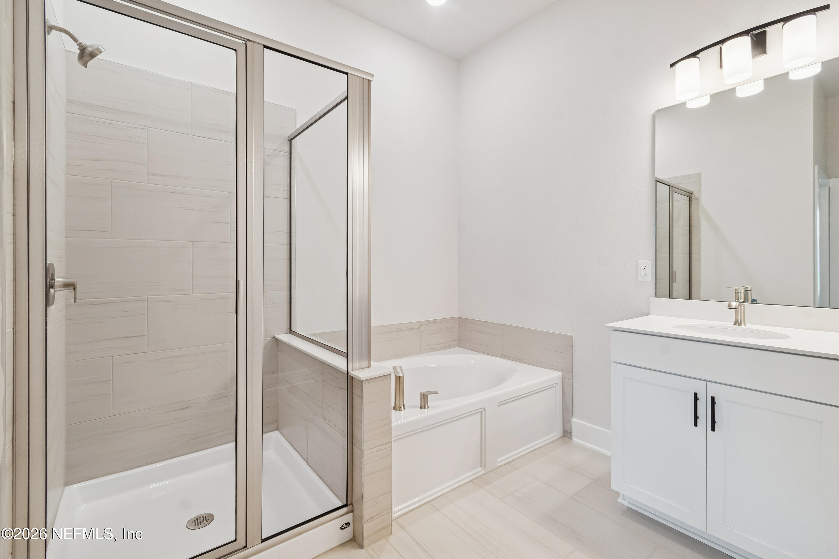 10165 Element Road Jacksonville, FL 32256 - Photo 23 of 25 a bathroom with a bathtub and a sink