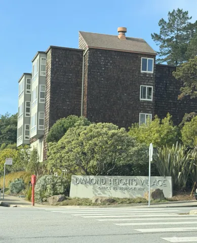 a view of a brick house with a yard