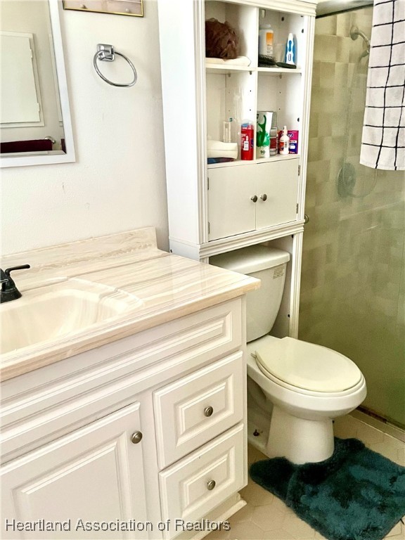 3401 Divot Road Sebring, FL 33872 - Photo 18 of 29 a bathroom with a toilet and a sink