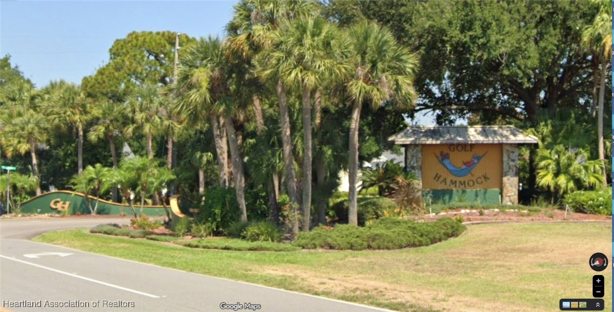 3401 Divot Road Sebring, FL 33872 - Photo 28 of 29 a view of a yard with plants and trees