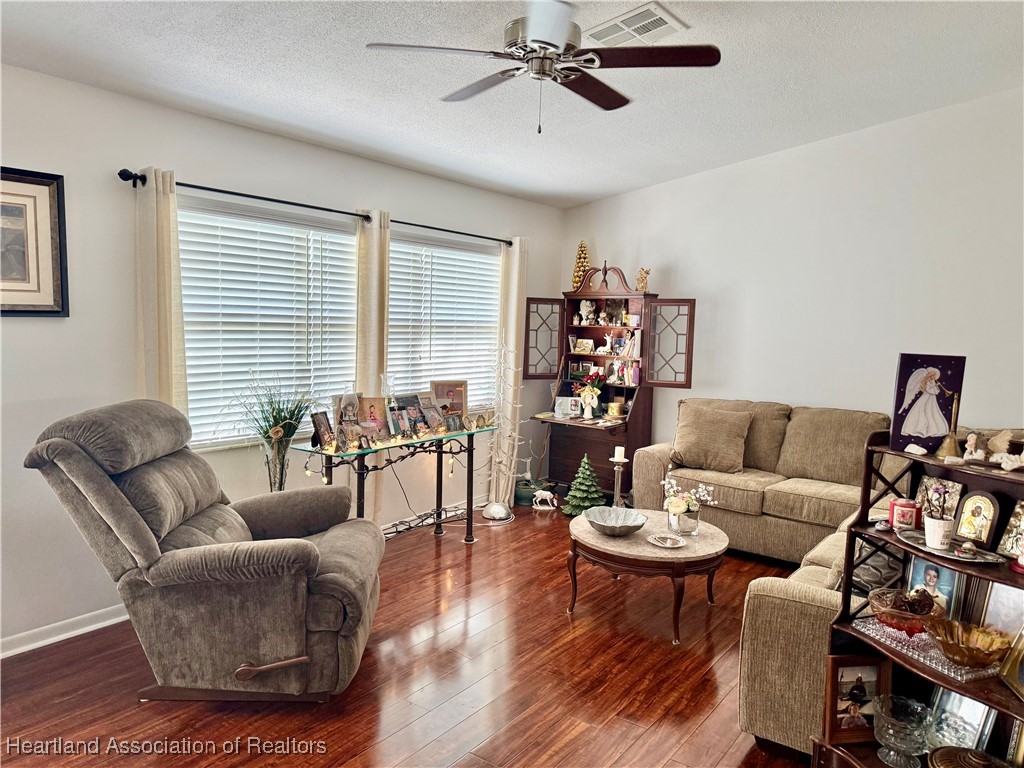 3401 Divot Road Sebring, FL 33872 - Photo 5 of 29 a living room with furniture and a wooden floor