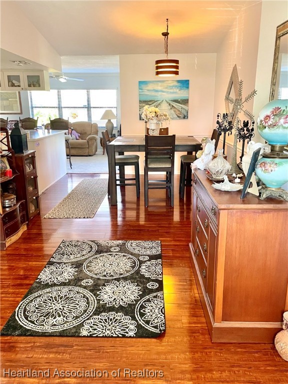3401 Divot Road Sebring, FL 33872 - Photo 8 of 29 a living room with dining room and wooden floor