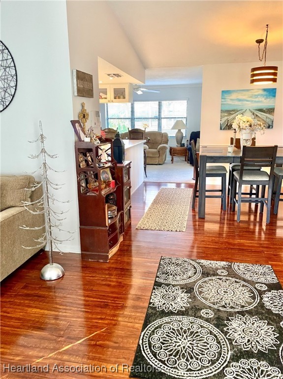 3401 Divot Road Sebring, FL 33872 - Photo 9 of 29 a living room with furniture wooden floor and a table