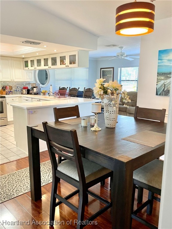 3401 Divot Road Sebring, FL 33872 - Photo 10 of 29 a view of a dining room with furniture and window