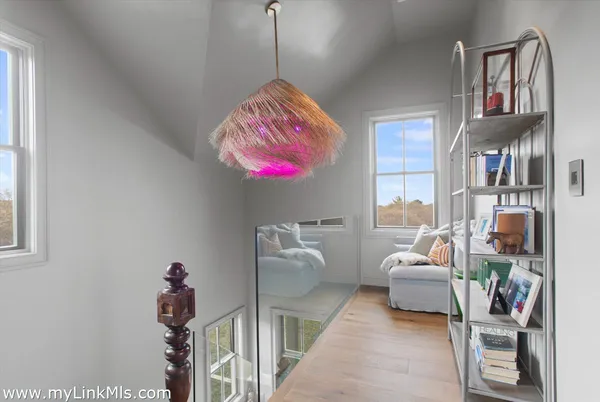 a bedroom with furniture and a chandelier