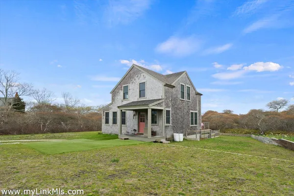 a view of a house with a big yard