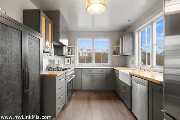 a kitchen with a sink stove and refrigerator
