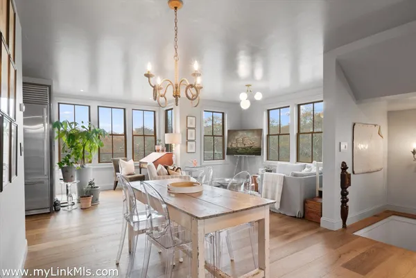 a very nice looking dining room with a table and chairs