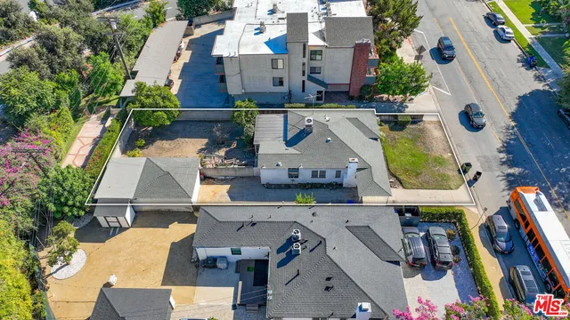 an aerial view of houses with outdoor space