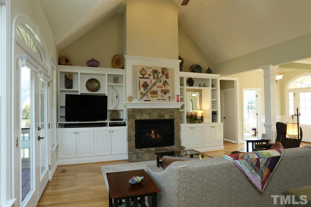 303 May Farm Road Pittsboro, NC 27312 - Photo 5 of 25 Beautiful stone on fireplace and custom built ins!