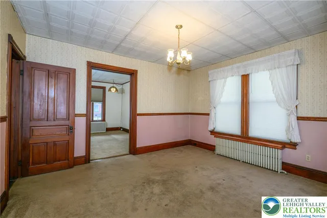 a room with furniture and window