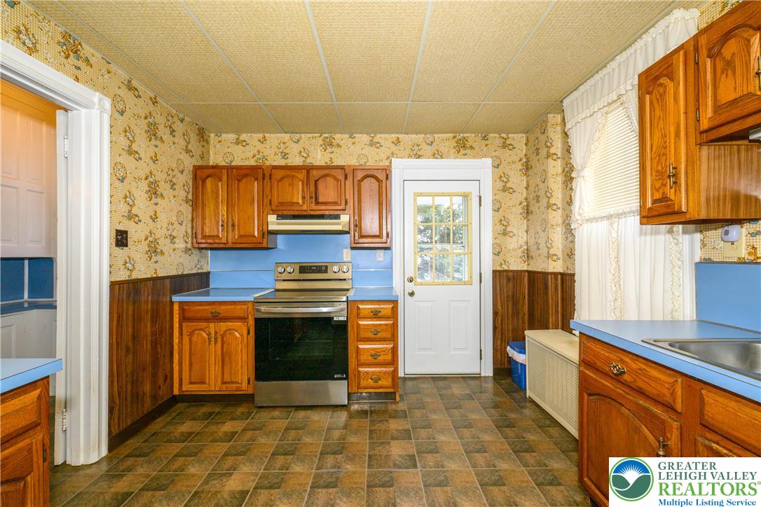 211 East Goepp Street Bethlehem, PA 18018 - Photo 13 of 36 a kitchen with stainless steel appliances granite countertop a stove a sink and a refrigerator