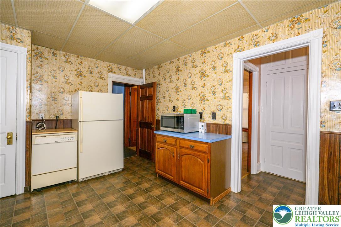 211 East Goepp Street Bethlehem, PA 18018 - Photo 15 of 36 a kitchen with stainless steel appliances a refrigerator a stove top oven a sink and dishwasher