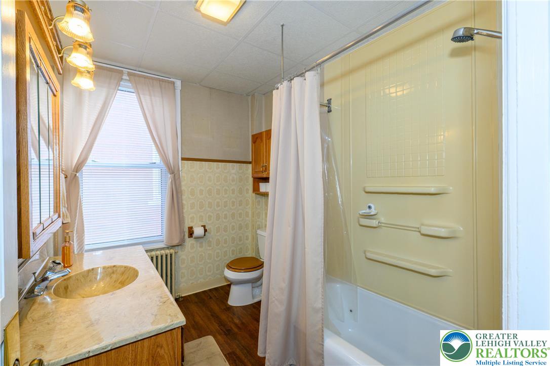 211 East Goepp Street Bethlehem, PA 18018 - Photo 21 of 36 a bathroom with a sink a toilet and shower