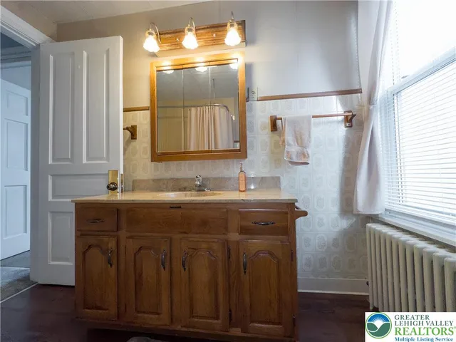 a aerial view of a house with sitting area and furniture