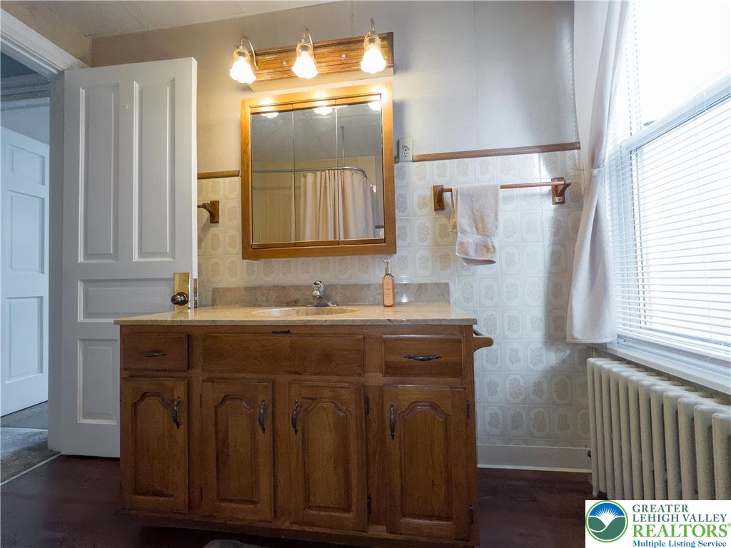 211 East Goepp Street Bethlehem, PA 18018 - Photo 22 of 36 a bathroom with a sink and a mirror