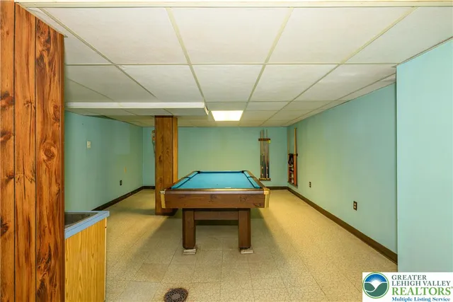 a view of a backyard with a tree