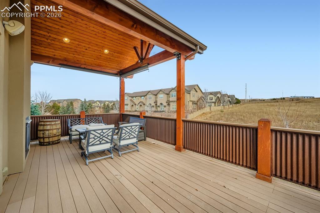 10625 Slumber Ridge Way Colorado Springs, CO 80908 - Photo 26 of 36 covered, and spacious composite deck with tongue and groove cover