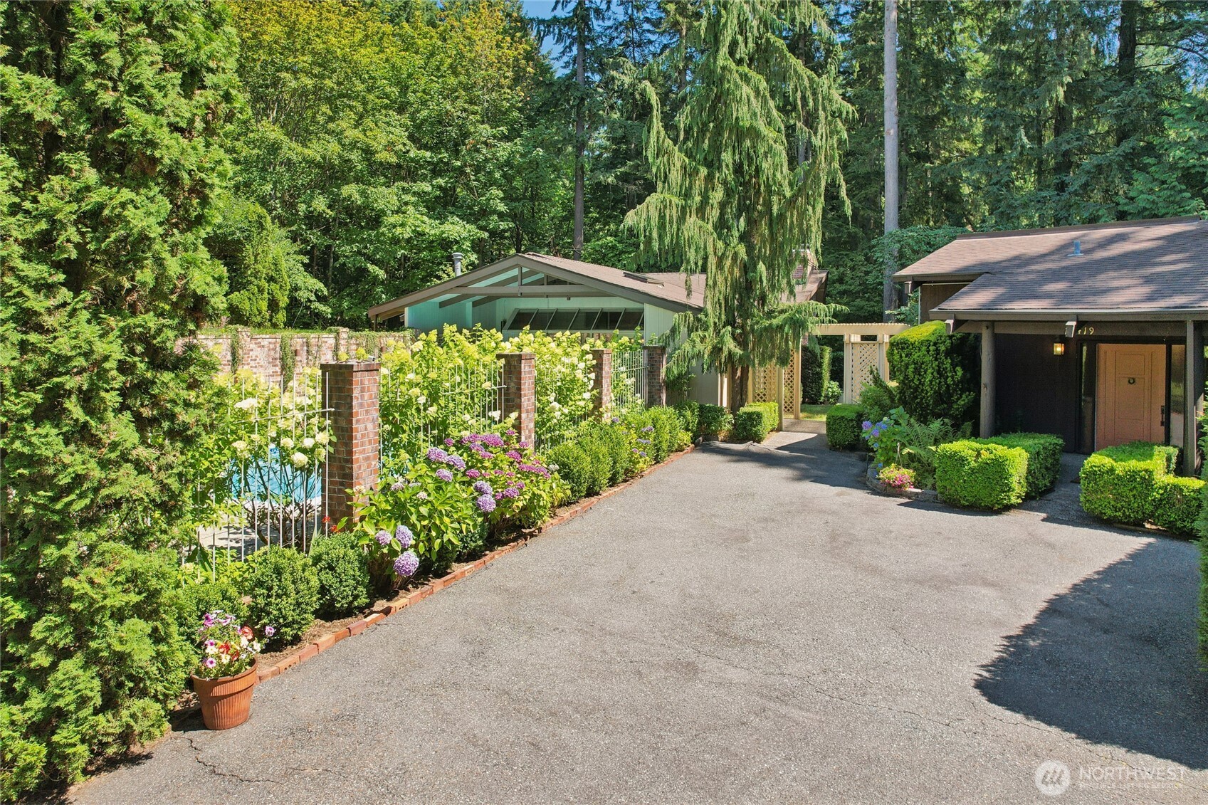 19419 Grannis Road Bothell, WA 98012 - Photo 1 of 40 a view of a garden with potted plants