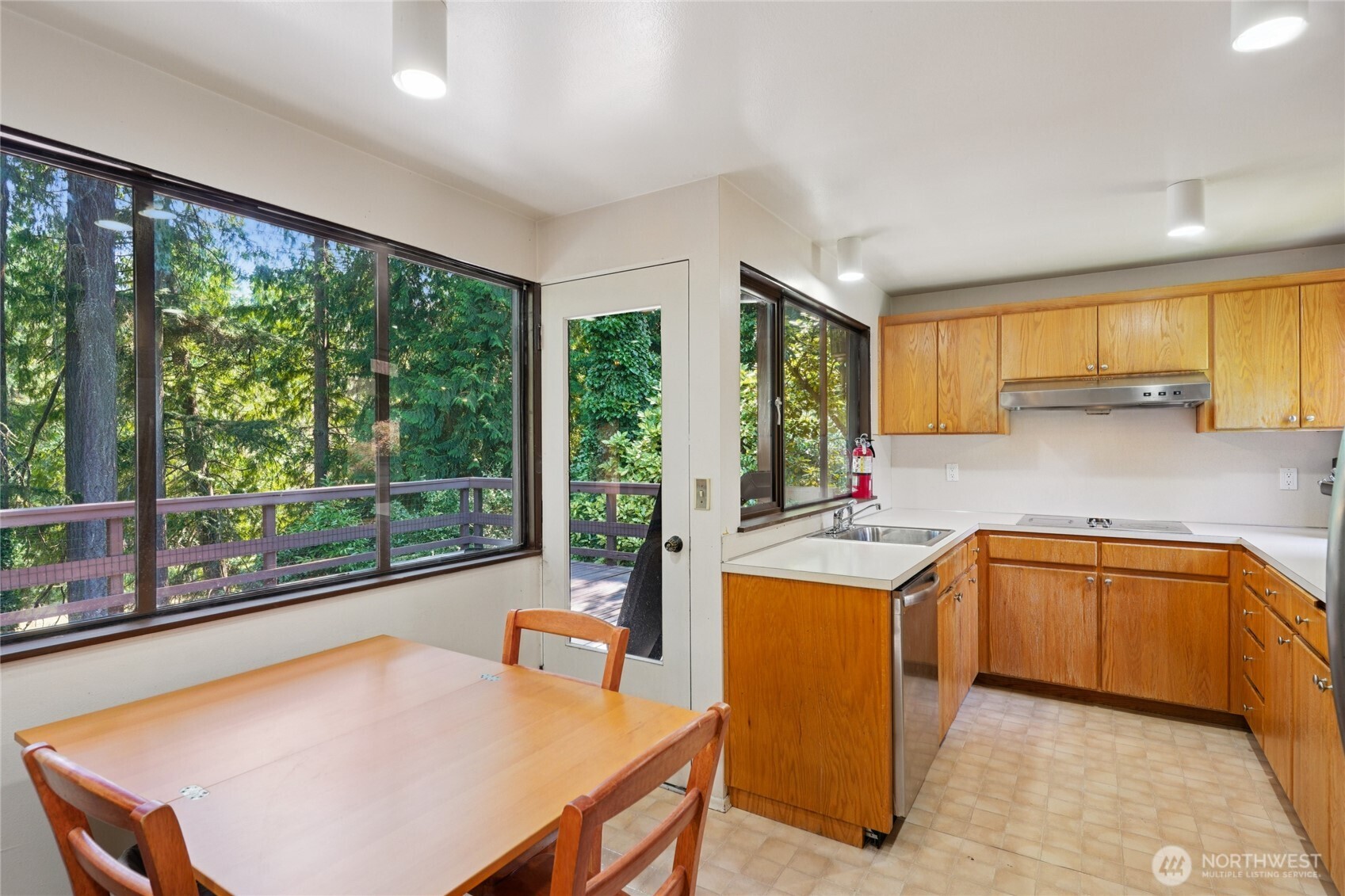 19419 Grannis Road Bothell, WA 98012 - Photo 21 of 40 a kitchen with a stove a sink and a refrigerator