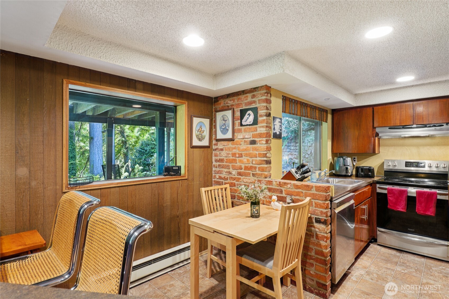 19419 Grannis Road Bothell, WA 98012 - Photo 27 of 40 a view of a dining room with furniture window and outside view