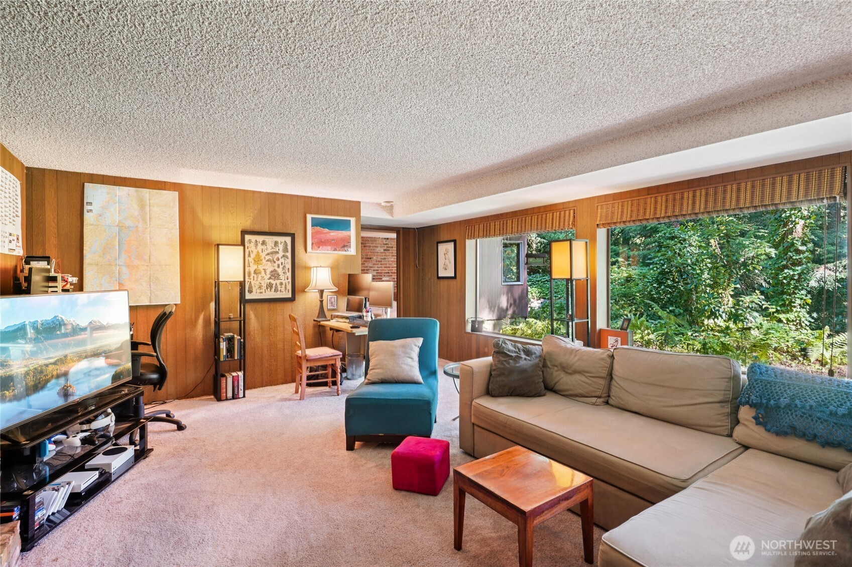 19419 Grannis Road Bothell, WA 98012 - Photo 33 of 40 a living room with furniture and a floor to ceiling window