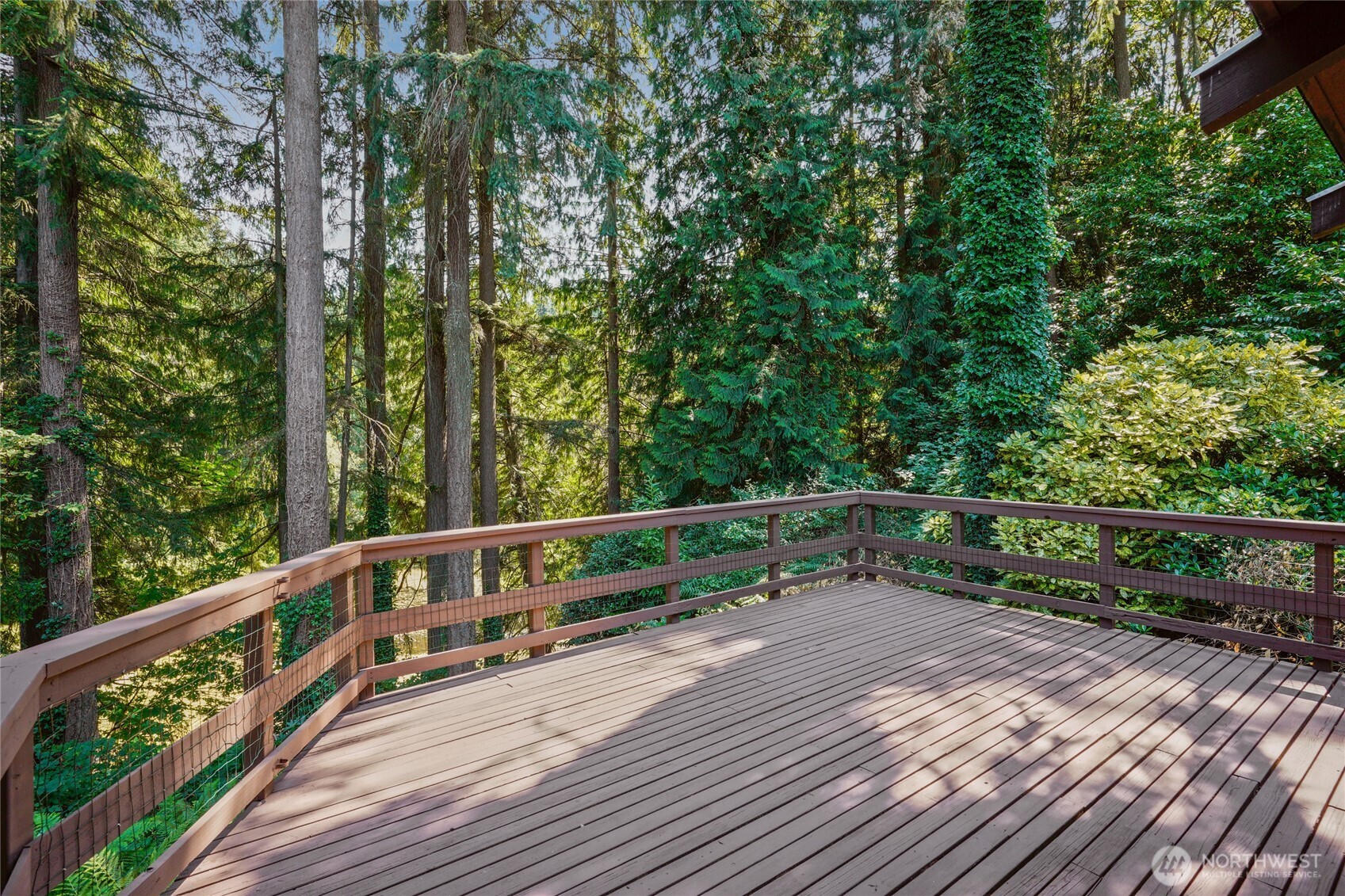 19419 Grannis Road Bothell, WA 98012 - Photo 36 of 40 a view of balcony with deck and wooden floor