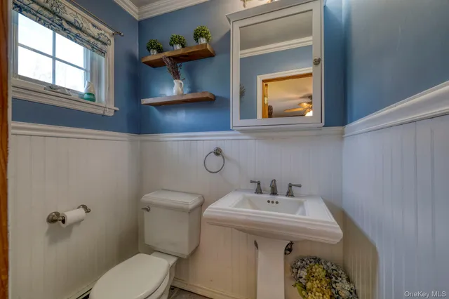 a bathroom with a sink and a toilet