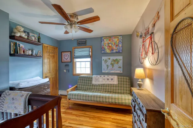 a bedroom with furniture and a window