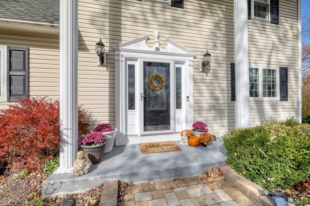 a front view of a house with outdoor space