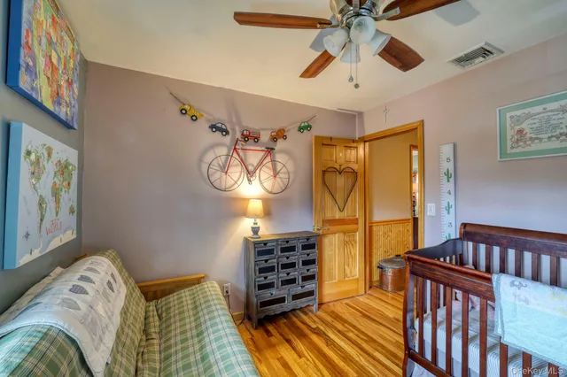 a bedroom with furniture and a chandelier