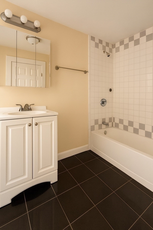 65 School Street Gardner, MA 01440 - Photo 14 of 21 a bathroom with a sink a toilet and a mirror