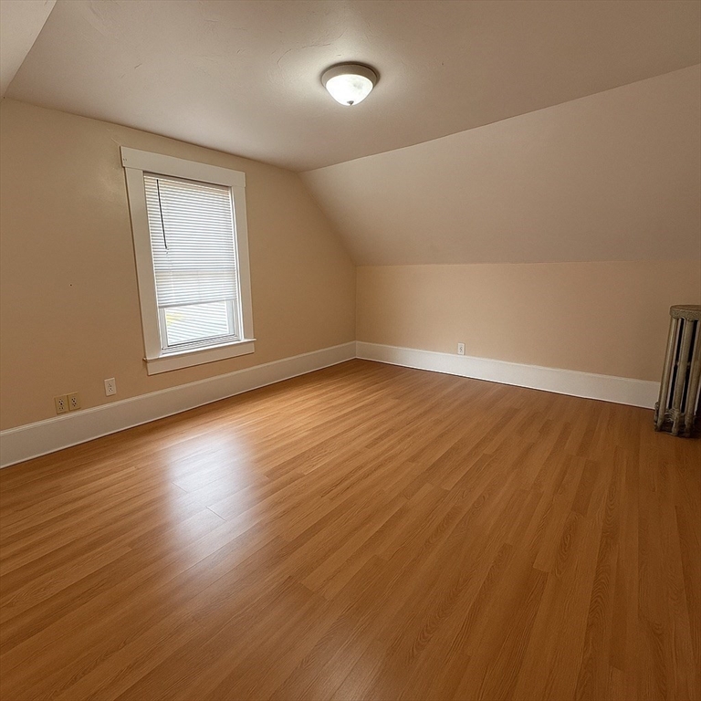 65 School Street Gardner, MA 01440 - Photo 16 of 21 an empty room with wooden floor and windows