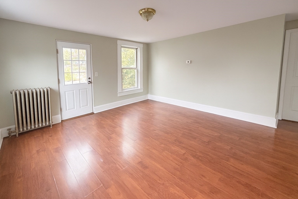 65 School Street Gardner, MA 01440 - Photo 19 of 21 an empty room with wooden floor and windows