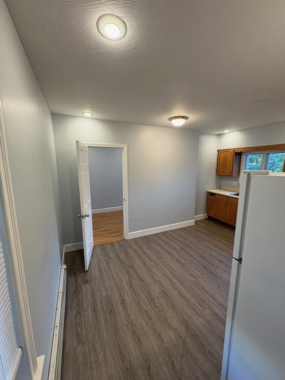 65 School Street Gardner, MA 01440 - Photo 5 of 21 a view of room with wooden floor
